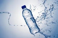 11347020 bottle-water-and-splash-johan-swanepoel